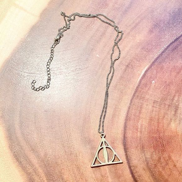 Warner Bros. Jewelry - ✨HARRY POTTER Deathly Hallows Symbol Necklace in Bronze Warner Bros Official✨